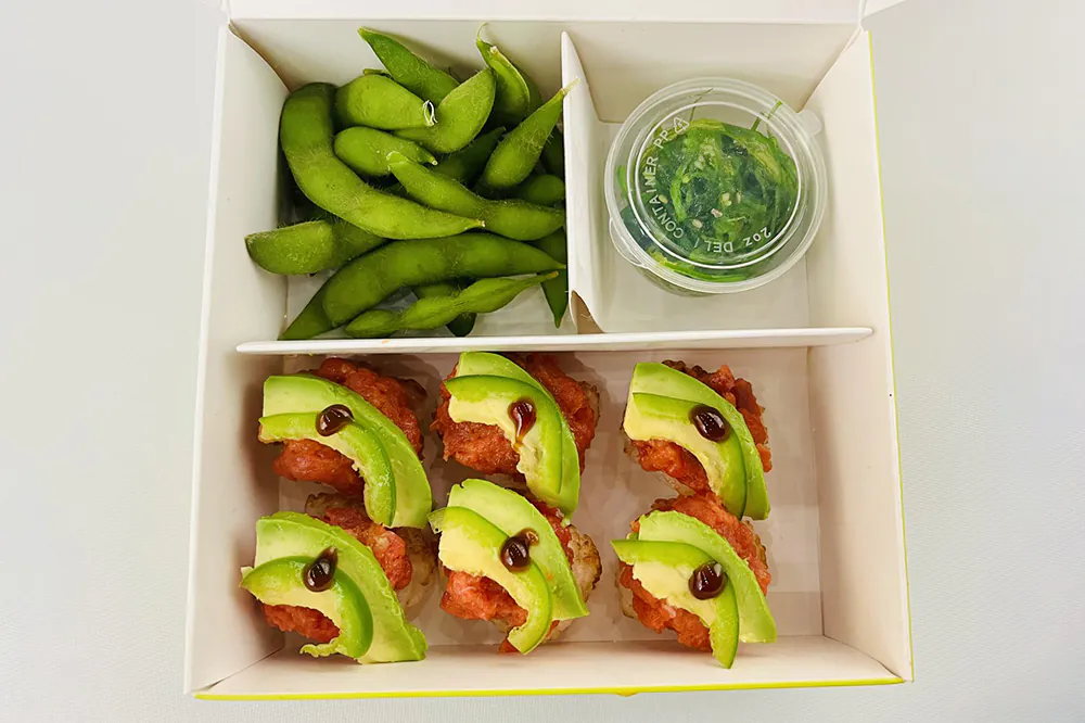Spicy tuna crispy sushi bento with edamame and seaweed salad