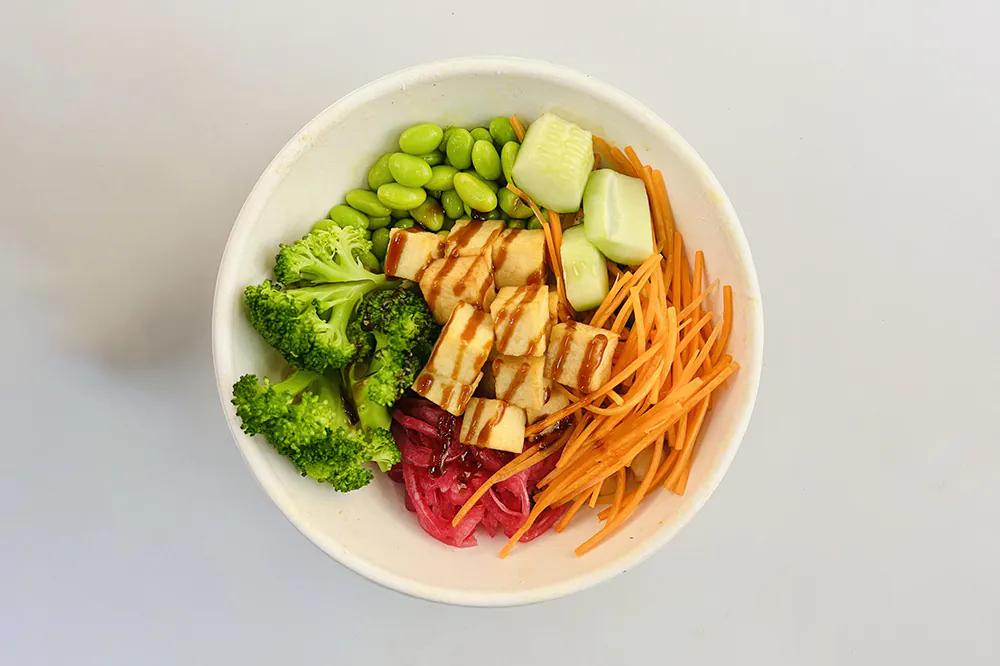 Tofu poke bowl with broccoli, edamame, carrot and pickled red onion